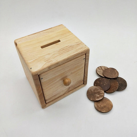 QToys Montessori Object permanence box toy with discs and drawer.