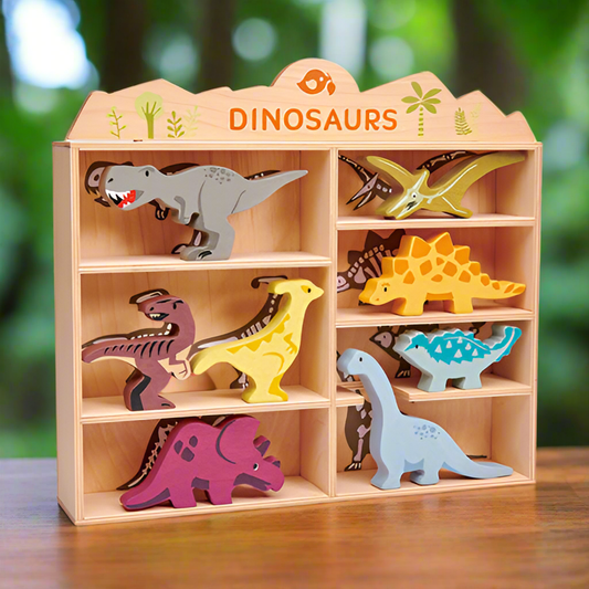 Wooden dinosaur toy set with a display case against a blurred green background