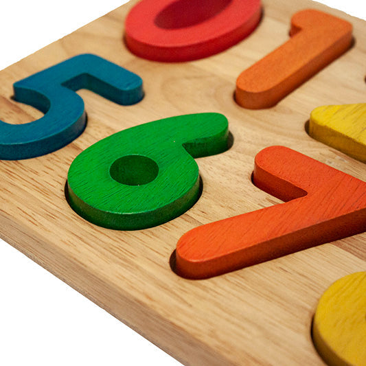 Wooden puzzle with colorful numbers on a white background